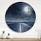 Designart - Asphalt Road Under Cloudy Full Moon I - Nautical & Coastal Metal Circle Wall Art